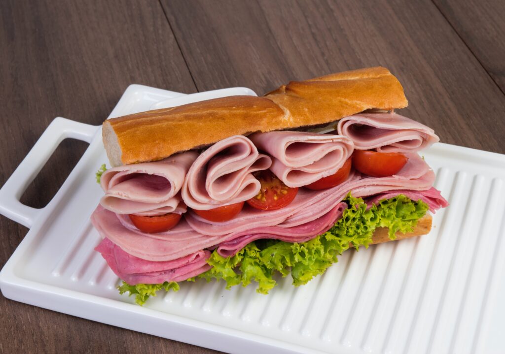 A sandwich with wet-cured hams inside