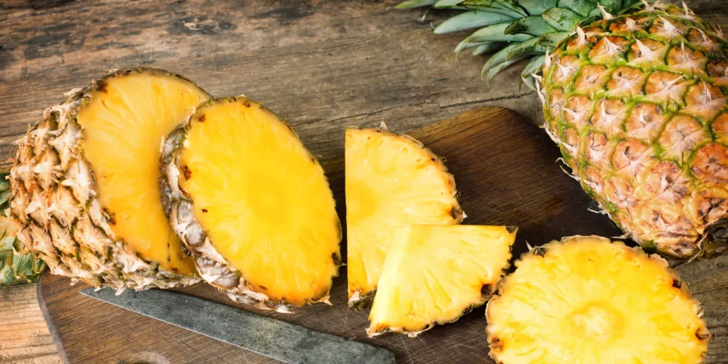 Pineapples slices on the wooden table
