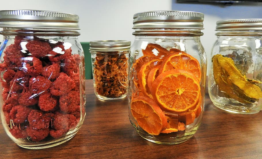Jars of dehydrated fruits on the table